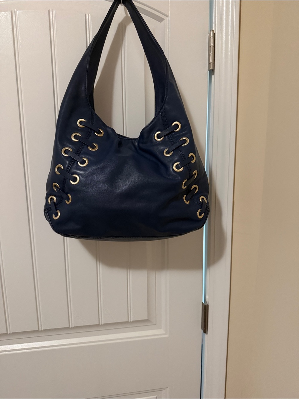 Michael Kors Navy Hobo Bag with Tassel and Gold Eyelets - Picture 3 of 10